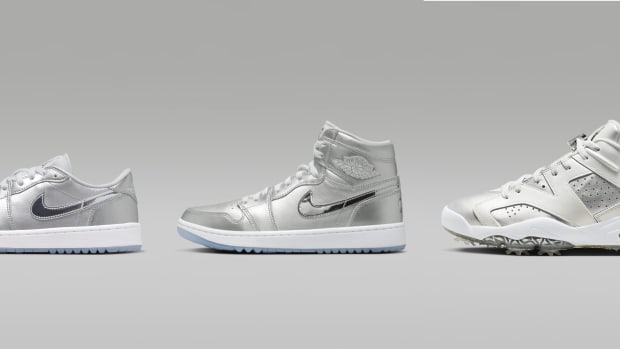 Side view of three silver Air Jordan golf shoes.